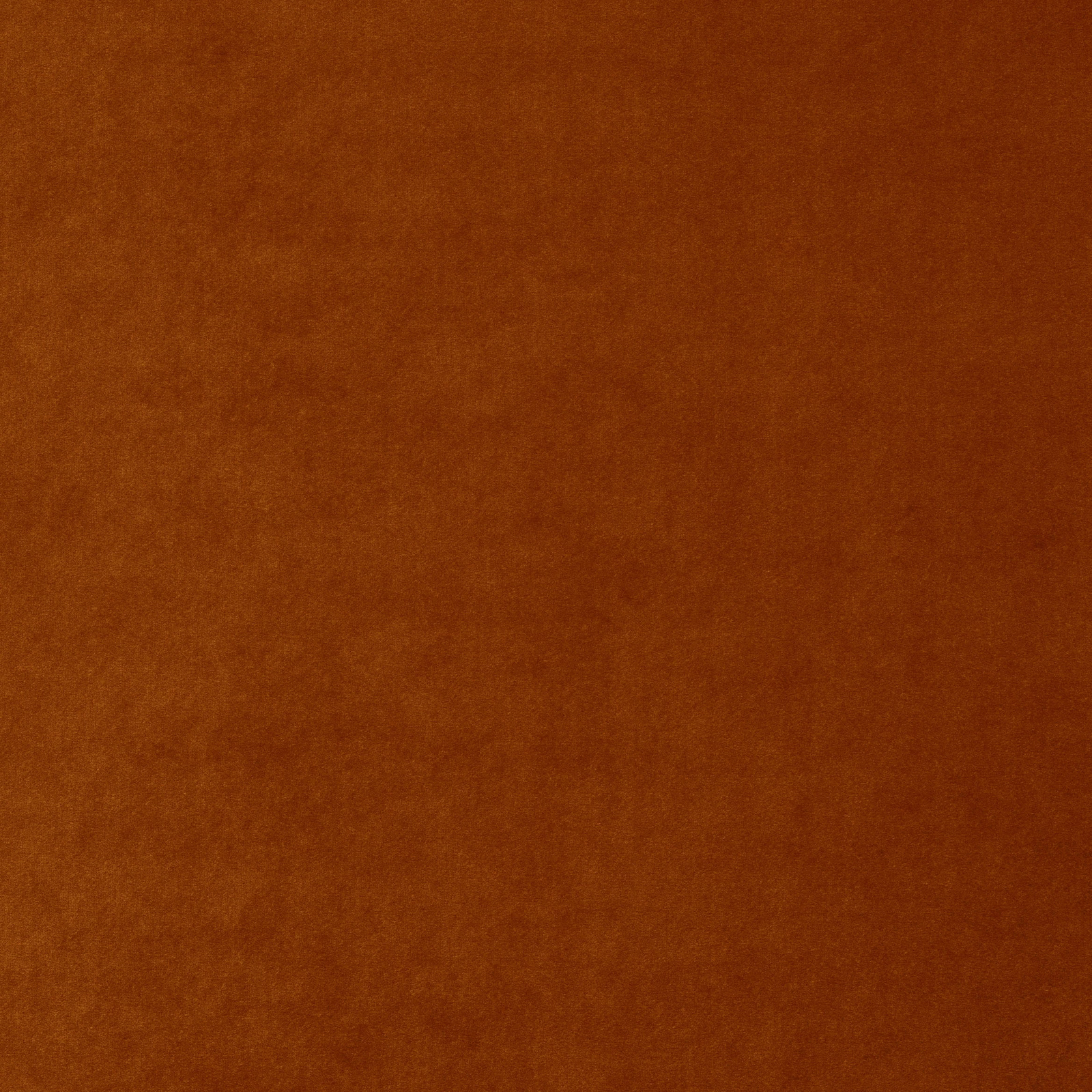 Warm burnt terracotta plain fabric with a soft, dense surface