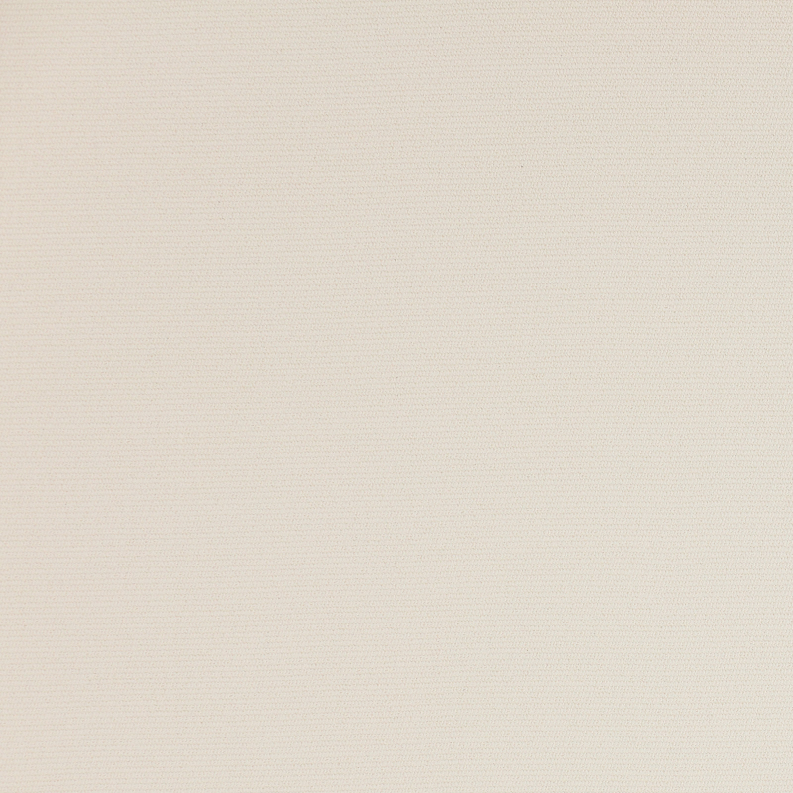 Close-up of a warm ivory plain woven fabric with a fine matte texture
