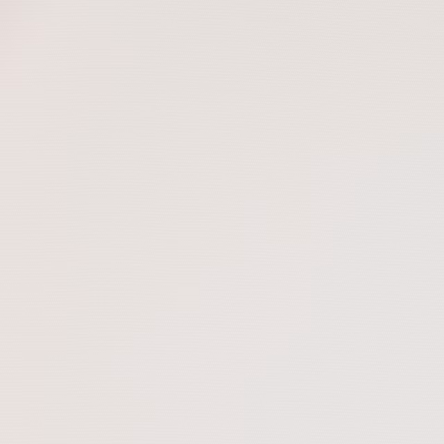 Soft ivory plain weave fabric swatch with a fine matte texture