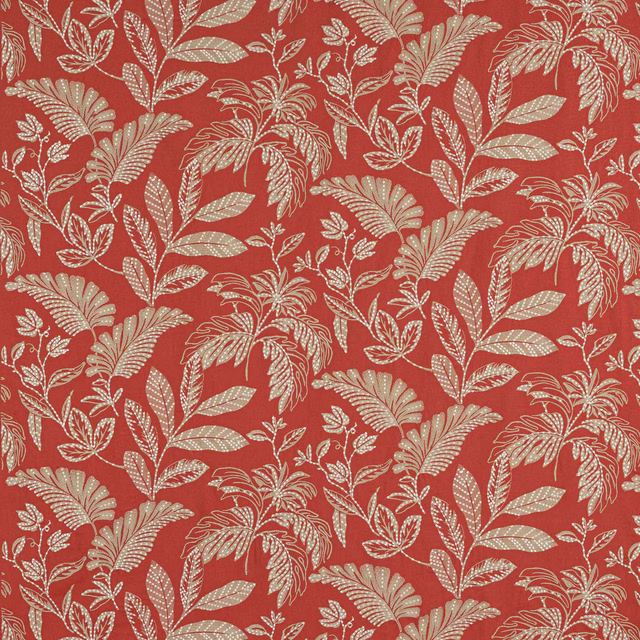 Red botanical fabric with cream leaf-and-fern pattern on a textured ground