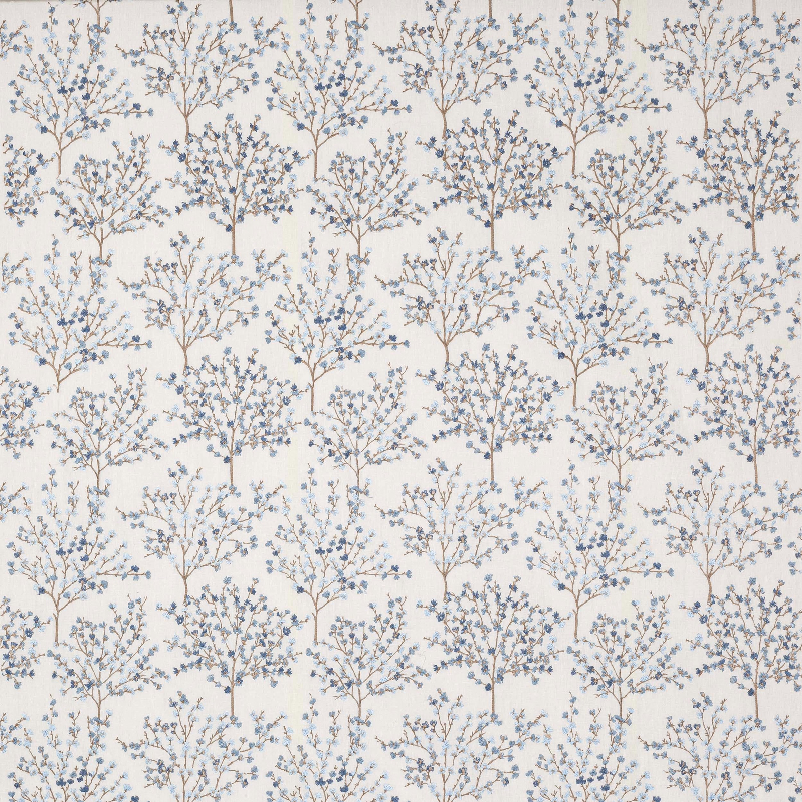 Pale botanical tree fabric with soft blue leaves on an ivory ground