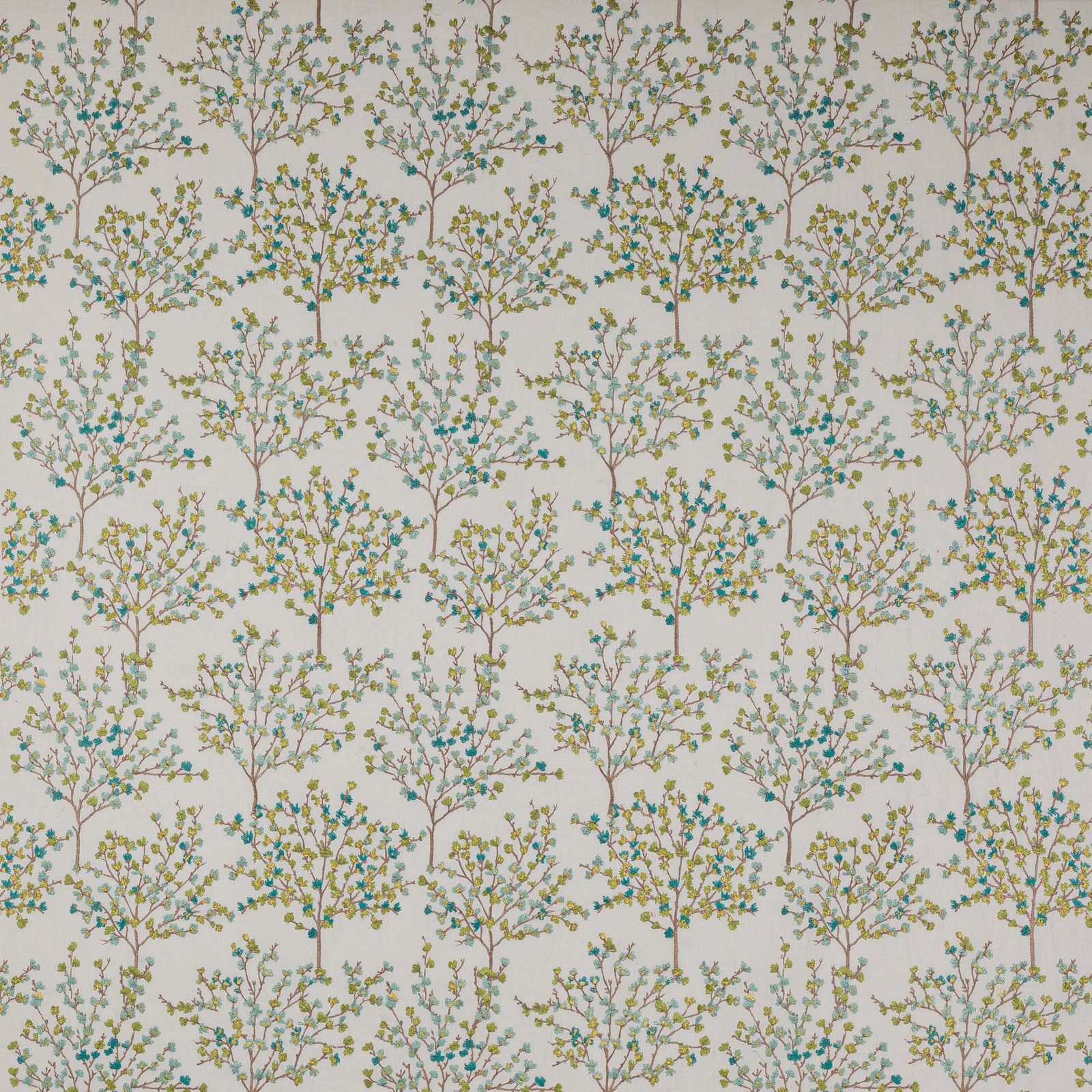 Lime and aqua tree motif fabric on a pale ground with fine branch detail