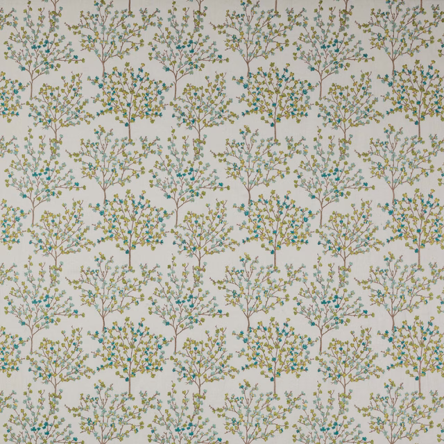 Lime and aqua tree motif fabric on a pale ground with fine branch detail