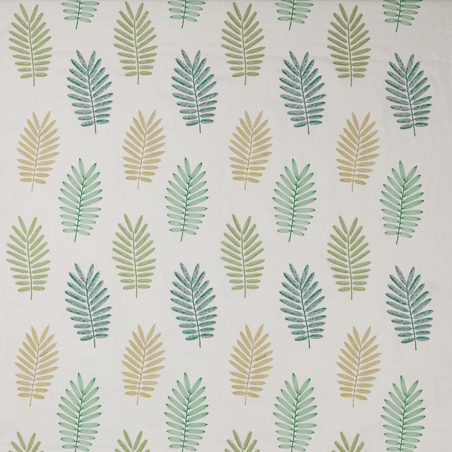 Repeating botanical leaf print in soft emerald, sage and yellow-green on a pale ground