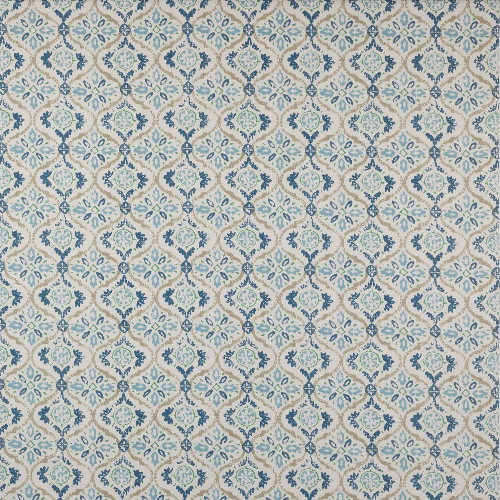 Swatch of small repeating blue and sage geometric medallions on an ivory cotton ground