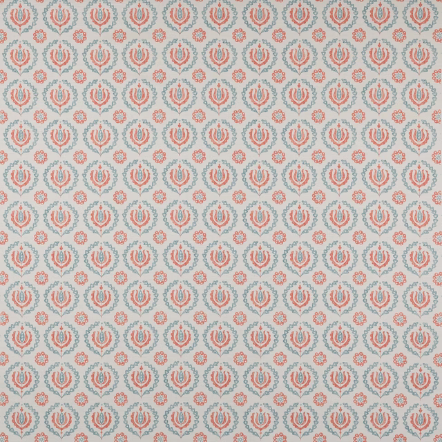 Small coral and slate botanical print on a pale cotton ground