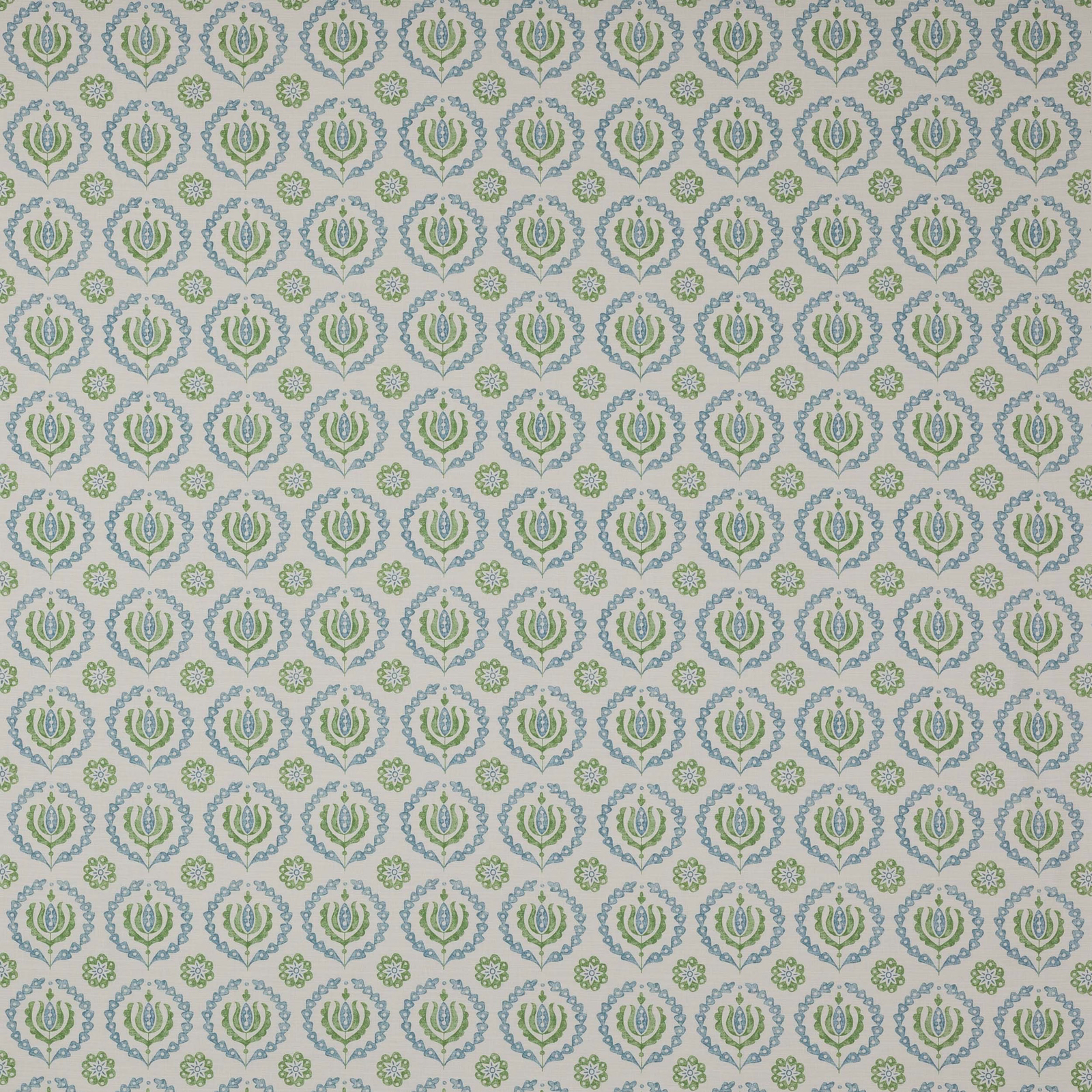 Pale cotton fabric with repeating small green and blue floral medallions