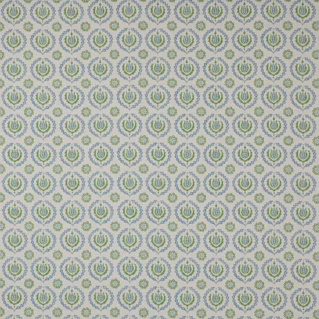 Pale cotton fabric with repeating small green and blue floral medallions