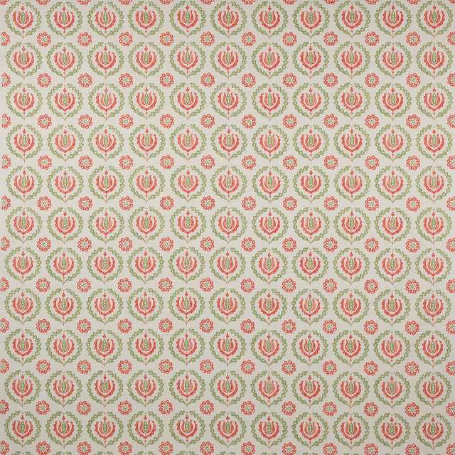 Small coral and green floral motifs on a pale ground, repeating in a neat printed pattern.