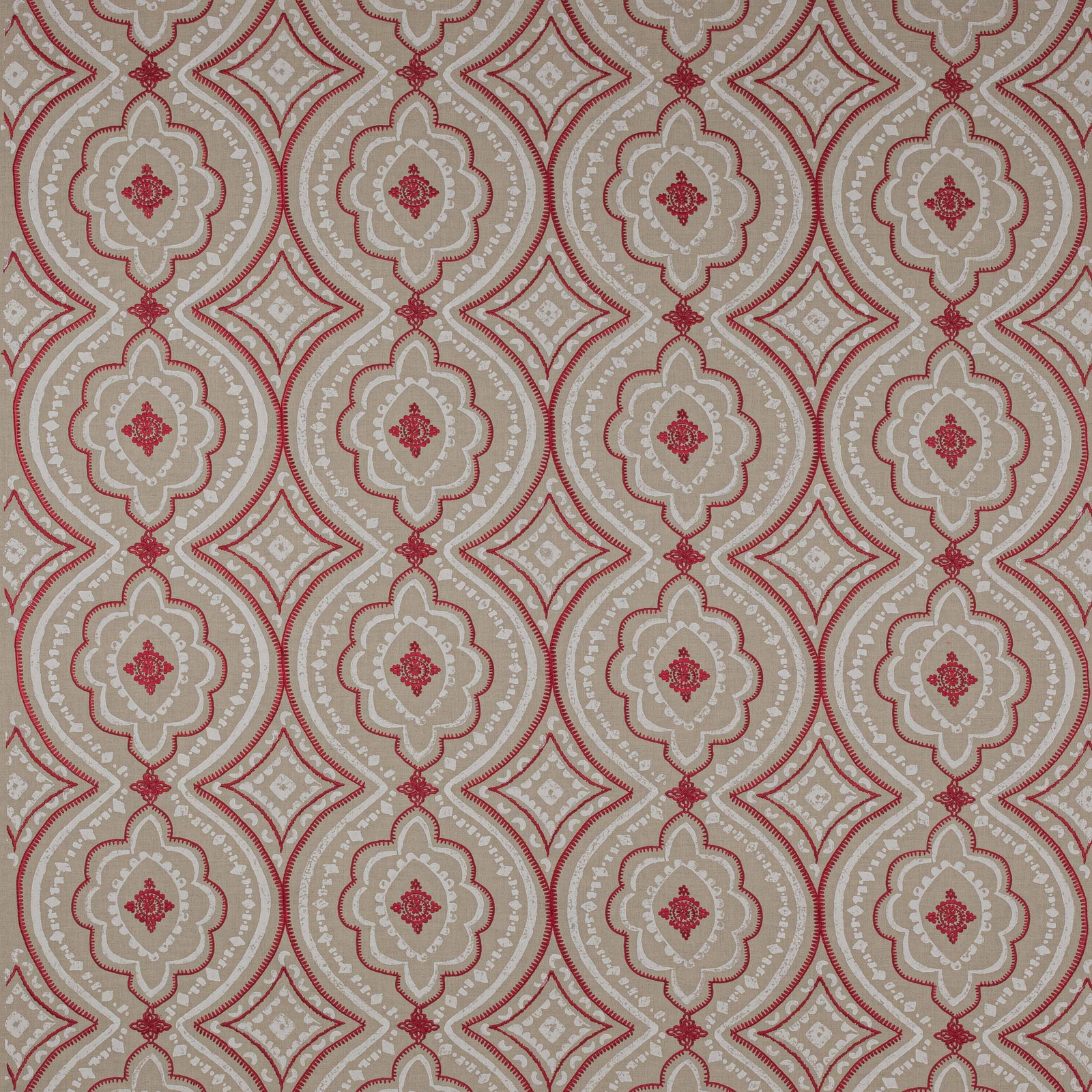 Patterned swatch with coral red medallions and diamonds on a pale neutral ground