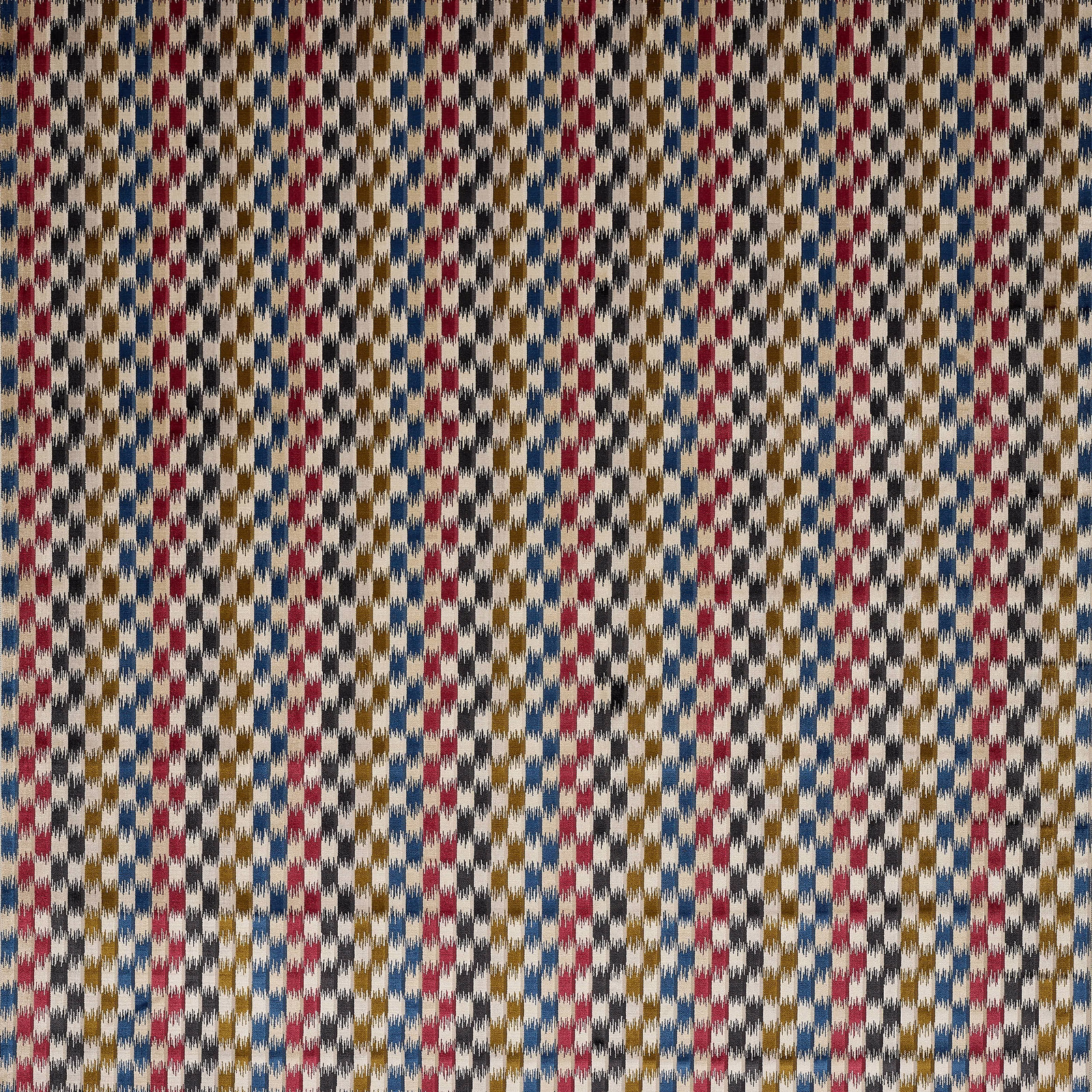 Cream velvet swatch with small red, blue and mustard geometric dashes