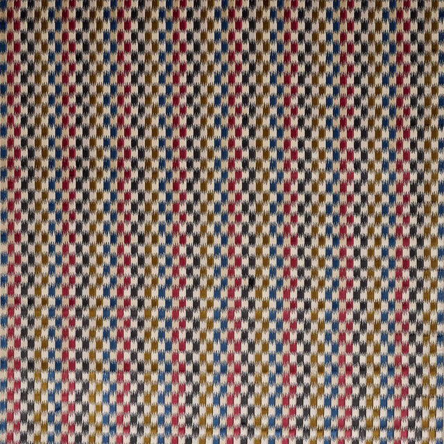 Cream velvet swatch with small red, blue and mustard geometric dashes