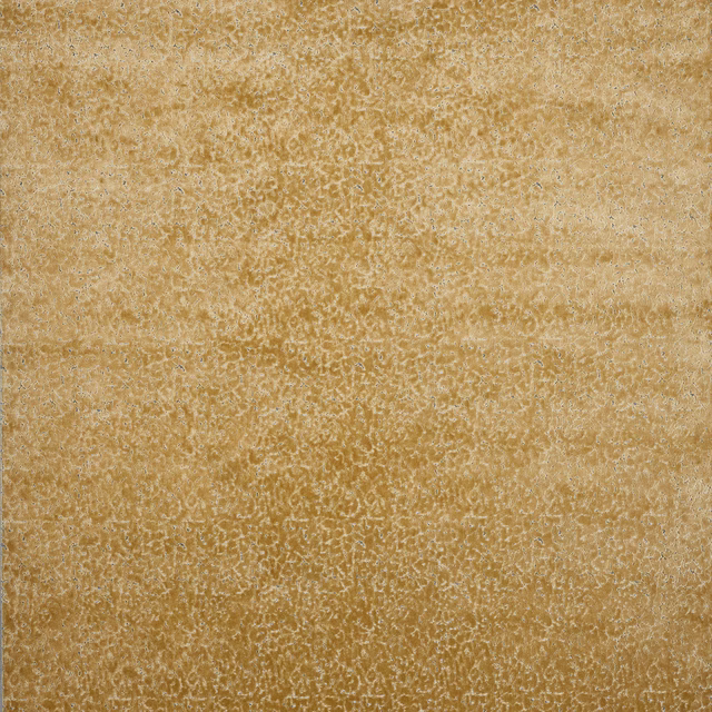 Close-up of biscuit-gold textured velvet with a softly speckled surface