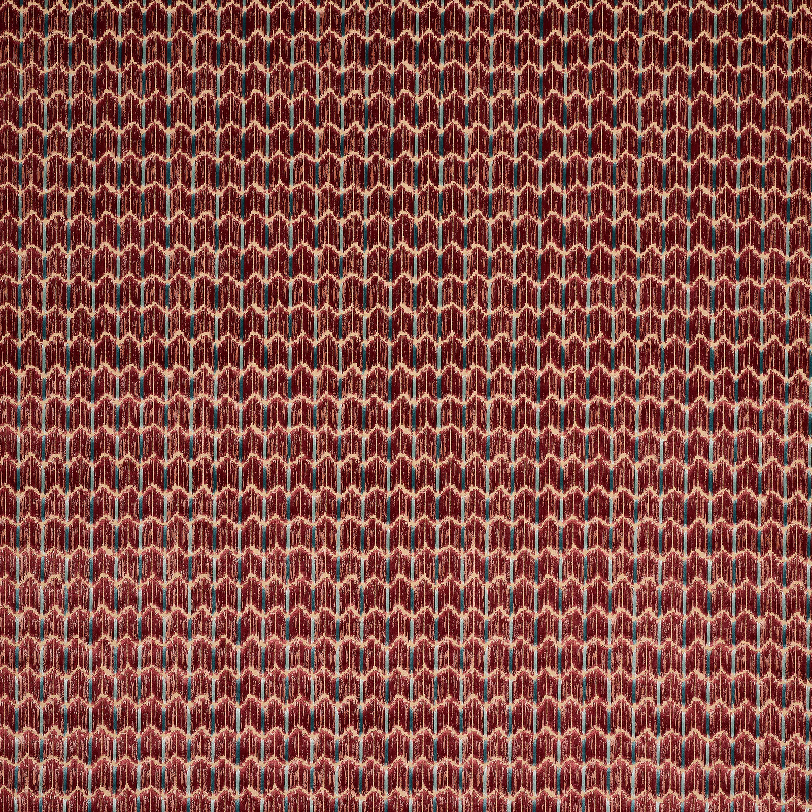 Close-up of deep ruby velvet with small geometric cream-outlined pattern