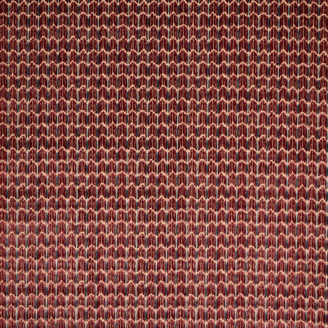 Close-up of deep ruby velvet with small geometric cream-outlined pattern