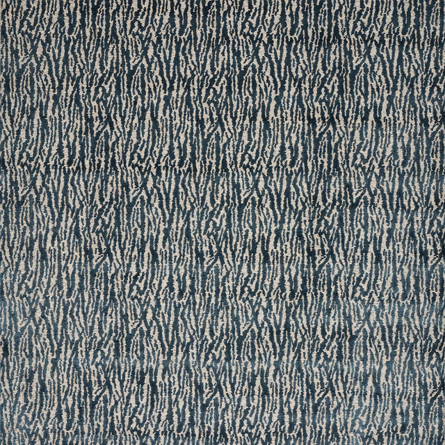 Blue velvet swatch with a small abstract broken-line pattern in dark teal and pale ground