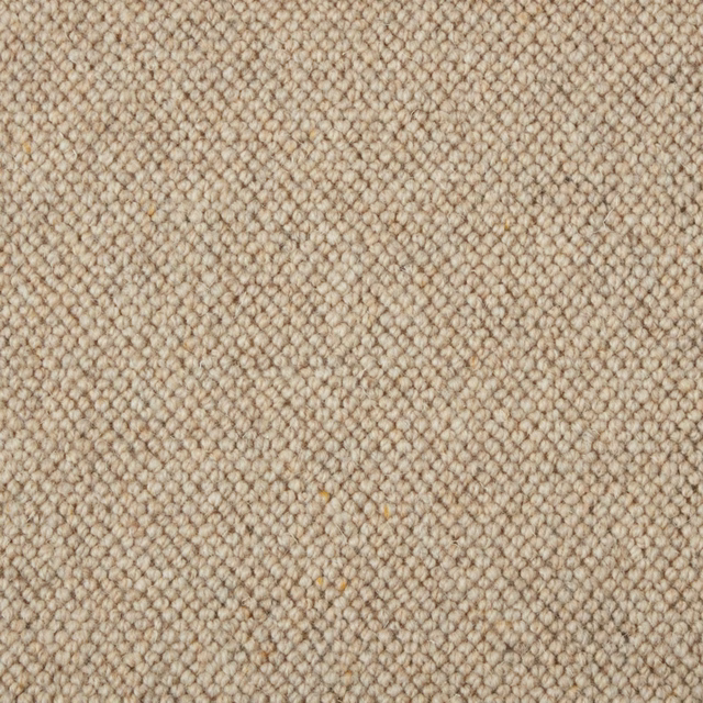 Warm cinnamon-beige wool loops with tiny brown flecks in a dense carpet texture