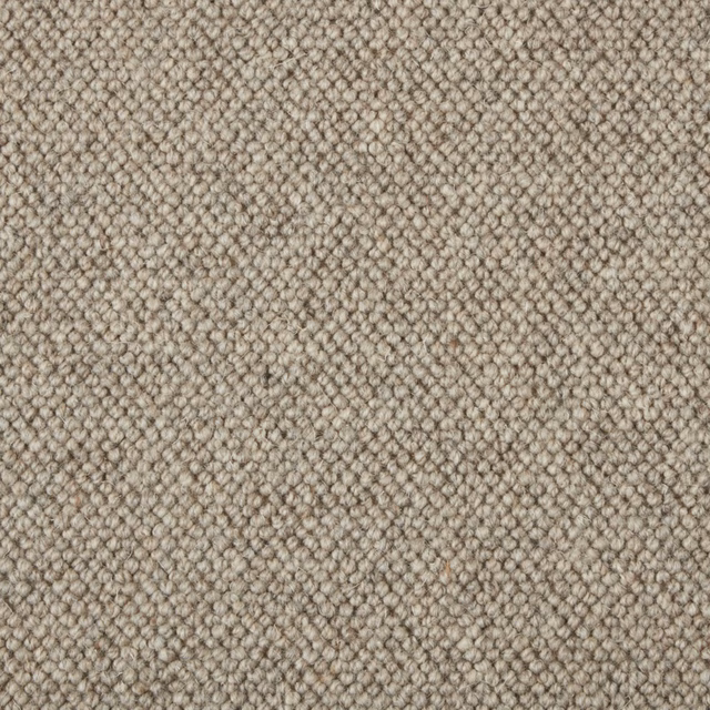 Close view of warm taupe-beige small loop texture with darker flecks