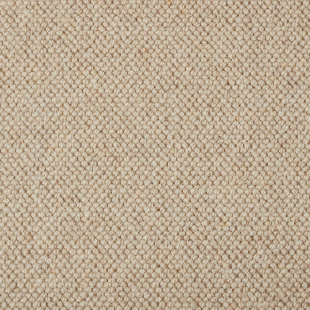 Warm oat-beige Fairisle carpet showing dense small wool loops and subtle darker flecking