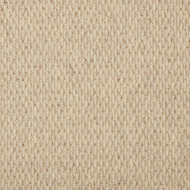 Warm oatmeal beige carpet with tightly looped, softly ridged vertical texture
