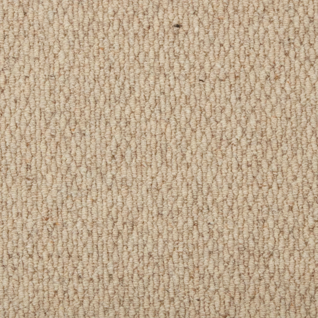 Warm oatmeal-beige wool loop carpet with irregular rows and subtle taupe flecks