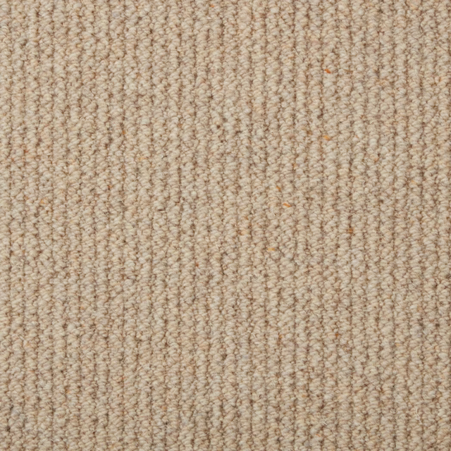 Warm oatmeal beige wool loop carpet with subtle taupe flecks and vertical texture