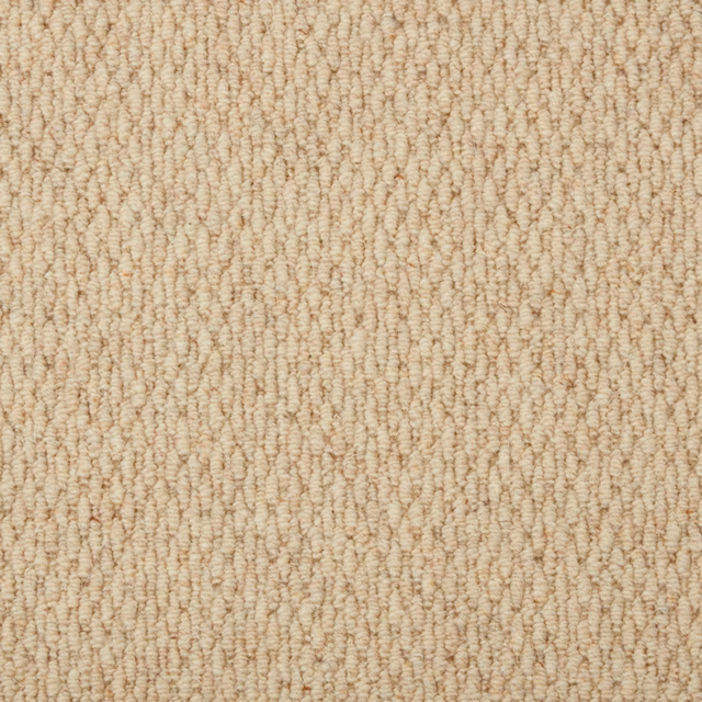 Warm oatmeal carpet with dense cream-and-tan loop rows and tactile texture