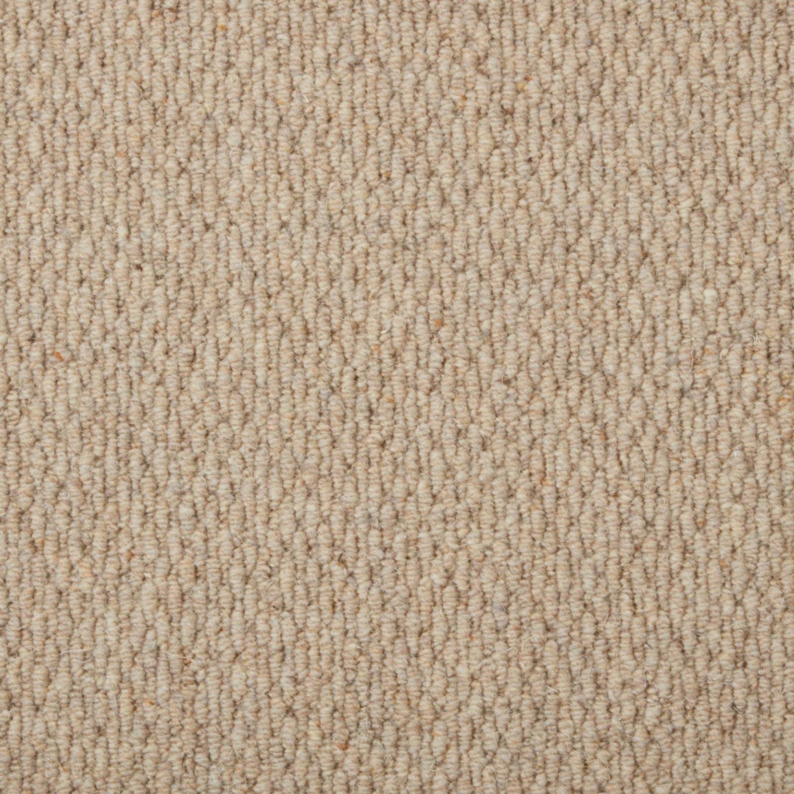 Warm oat-beige carpet with dense irregular loop rows and subtle taupe flecks