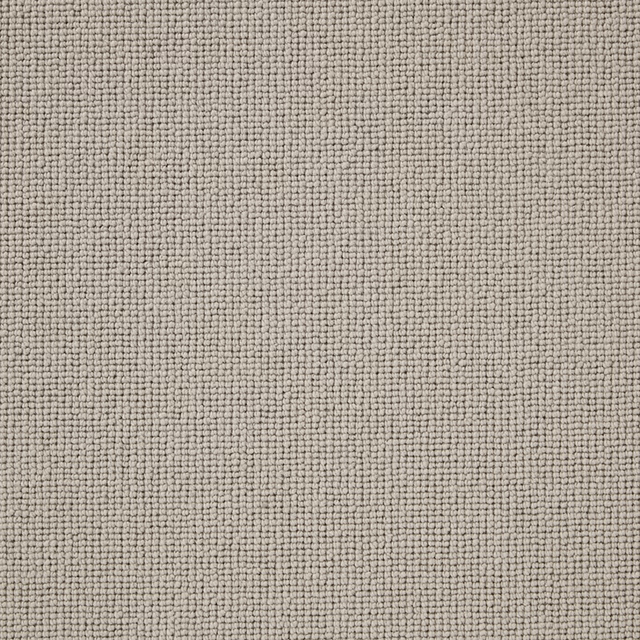 Close view of warm cement-grey Wool Loop with dense, softly mottled loops
