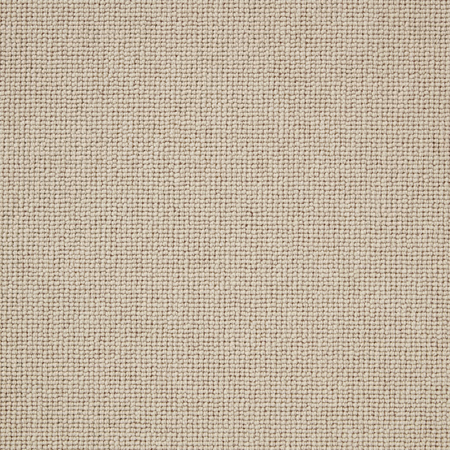 Close-up of warm oyster-beige wool loop texture with subtle grey flecks