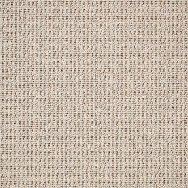 Pale ivory-beige wool loop carpet with compact rows and softly mottled texture