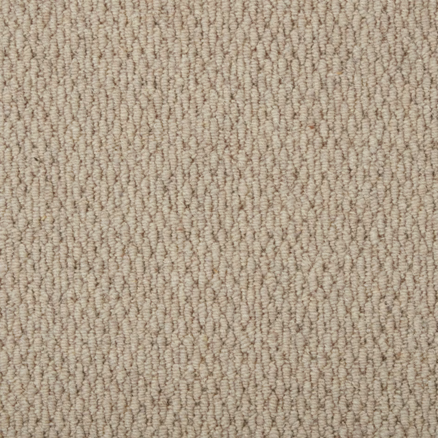 Warm beige carpet swatch with dense cream and taupe looped texture