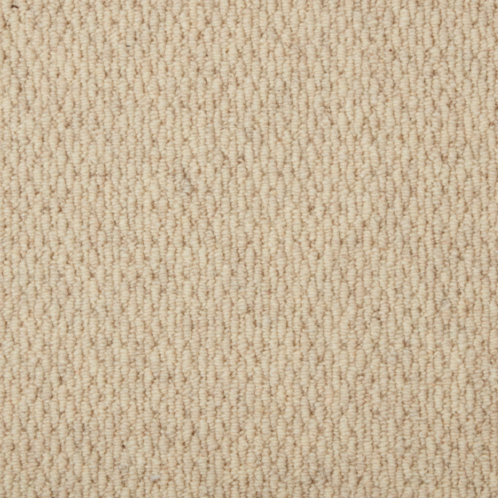 Warm oatmeal beige carpet with fine irregular loops and softly ridged texture