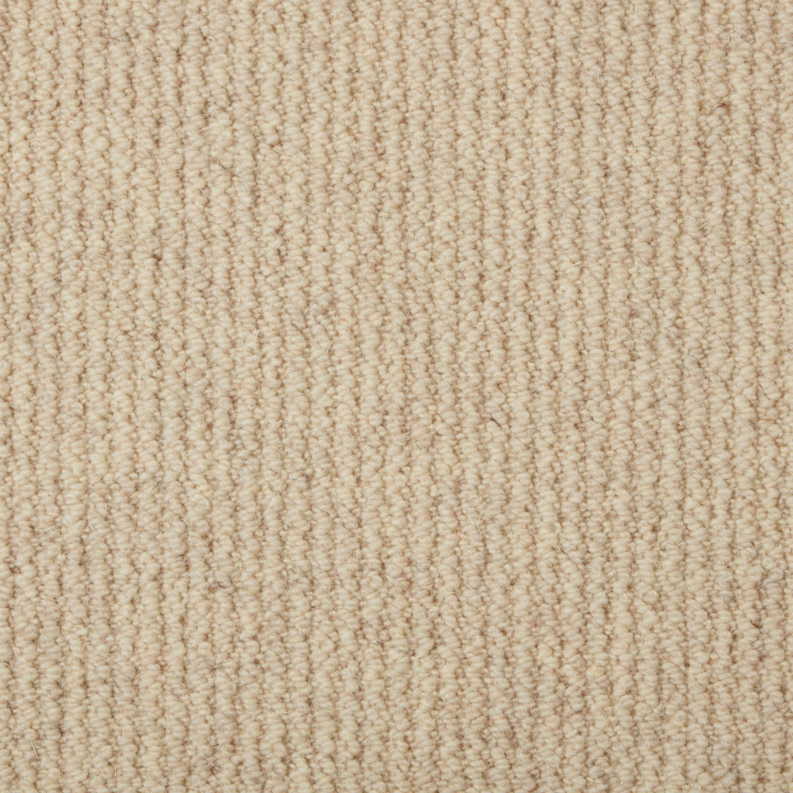 Warm oatmeal beige loop carpet with fine vertical ridges and flecked texture