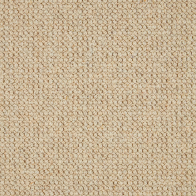Close-up of warm oatmeal-beige Bronte 122 wool loop carpet with small nubby loops