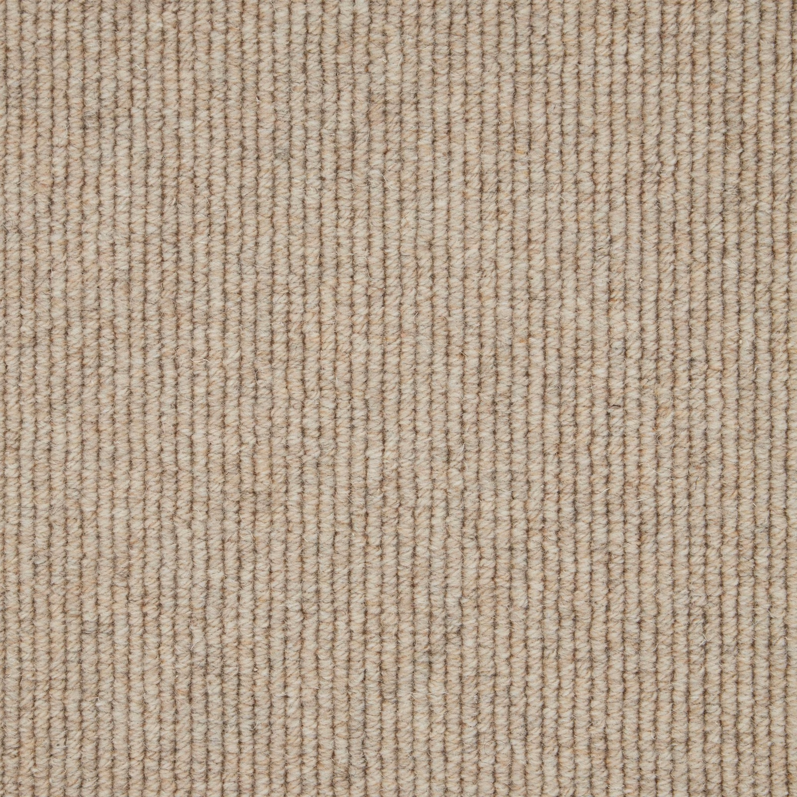 Warm oatmeal-beige wool loop carpet with fine, irregular vertical rib texture