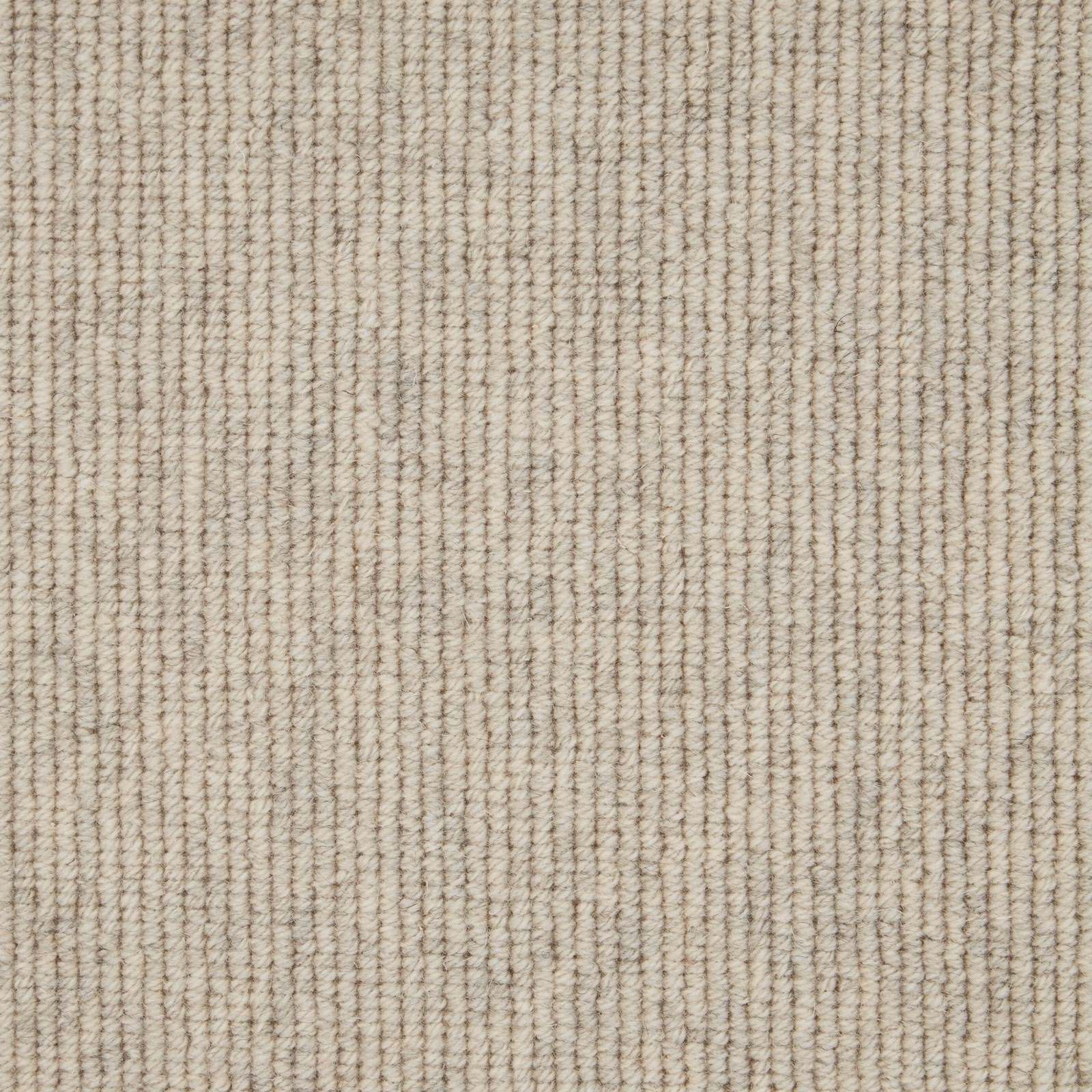 Warm oatmeal-beige wool loop carpet with fine vertical ribbed texture