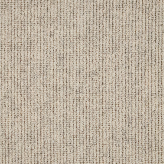 Warm oatmeal-beige wool loop carpet with fine vertical ribbed texture