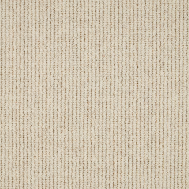 Warm ivory Wool Loop carpet with fine uneven vertical ribbing and tactile texture