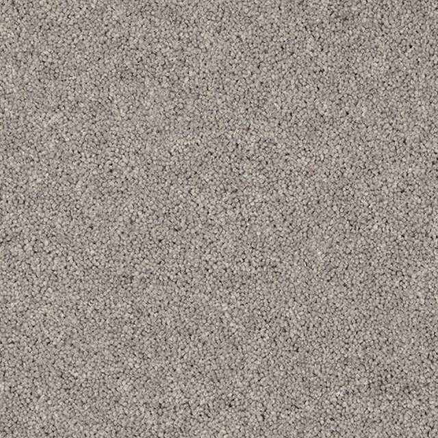 Close-up of mottled slate-grey wool twist carpet with a dense pebbled texture