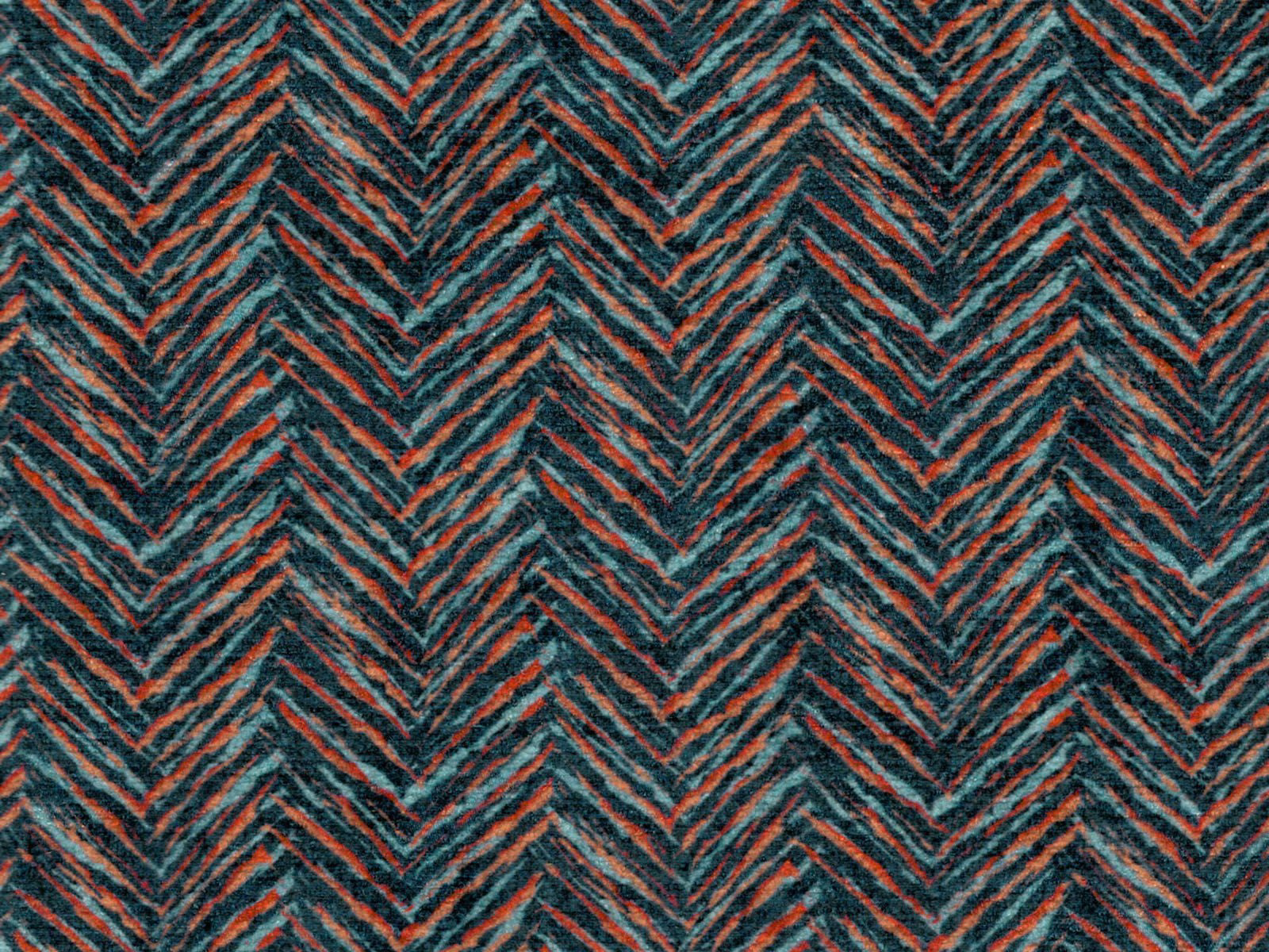 Dark teal chenille with rust coral zigzag chevrons and a soft textured pile