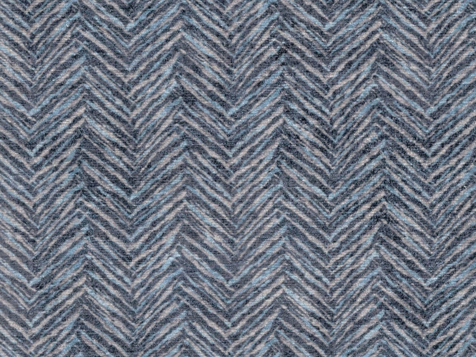 Blue-grey chenille with repeating chevron stripes and subtle taupe-grey flecks