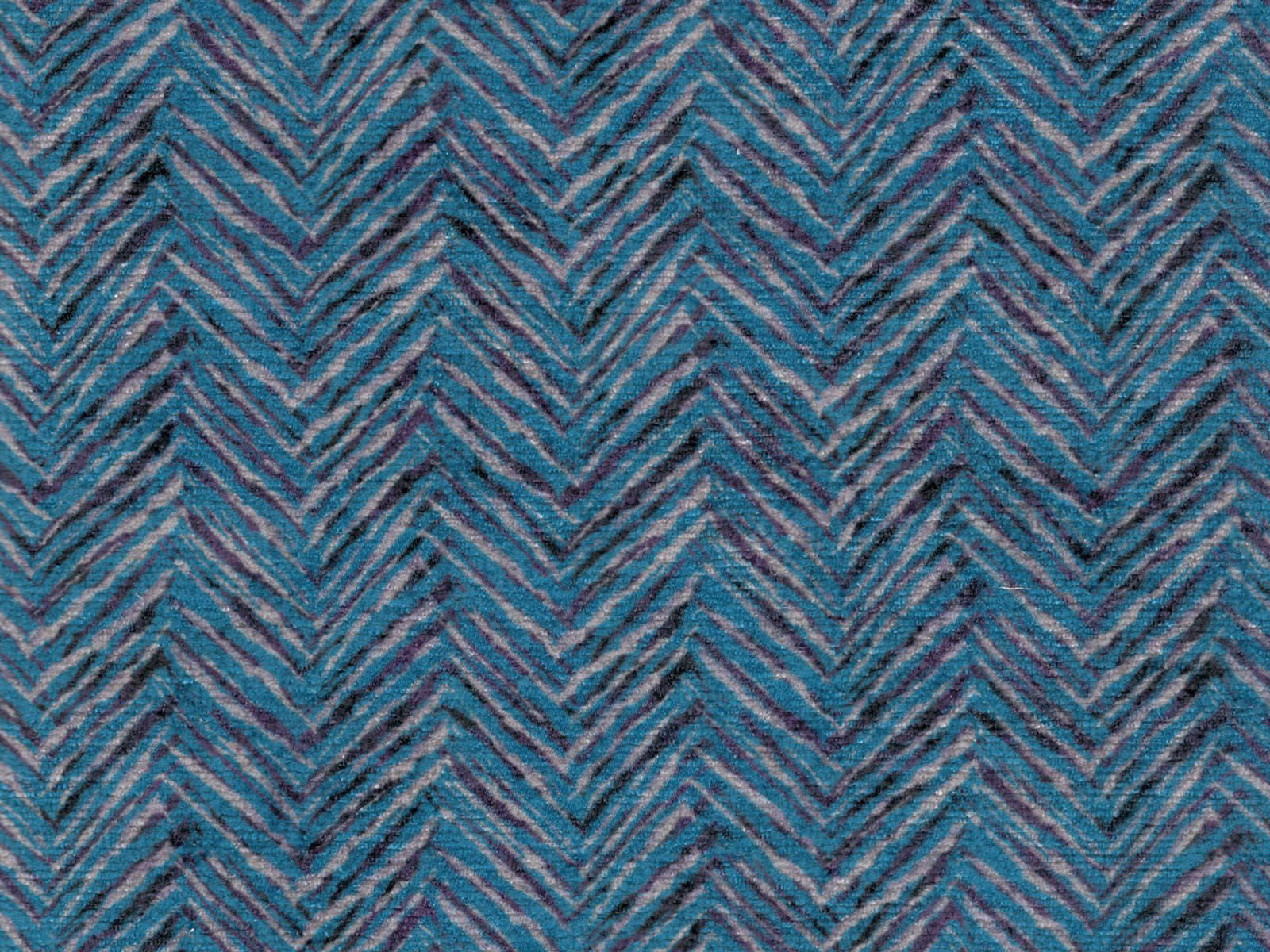 Muted blue-teal chenille with charcoal and plum chevron zigzags and a softly textured weave