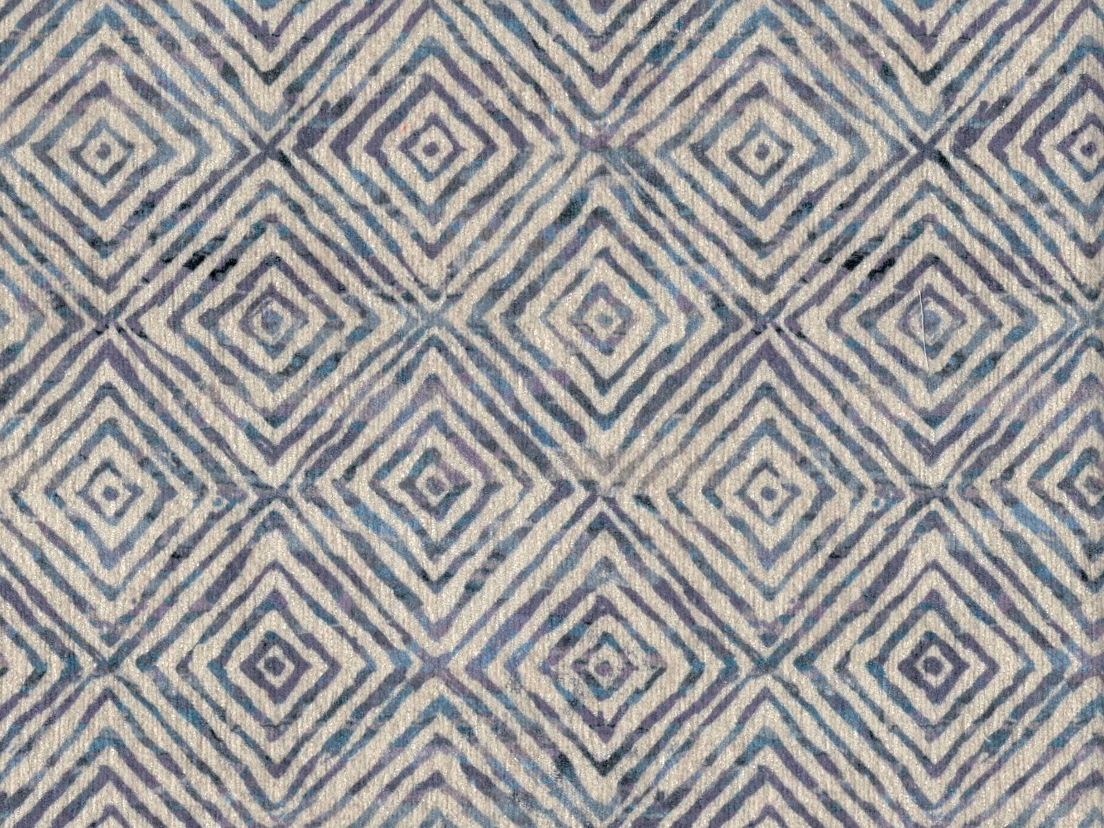 Dusty blue-grey and ivory chenille showing repeating diamond and chevron motifs