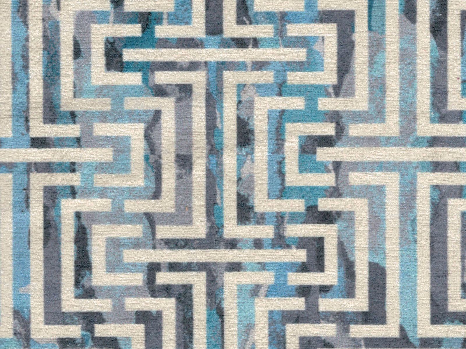 Teal, cream and grey chenille with a bold interlocking geometric maze motif