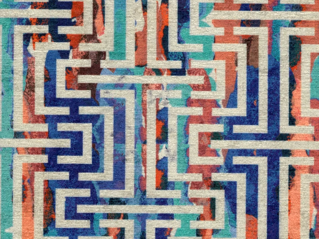 Teal, navy, red and cream chenille with interlocking angular maze lines and tactile weave