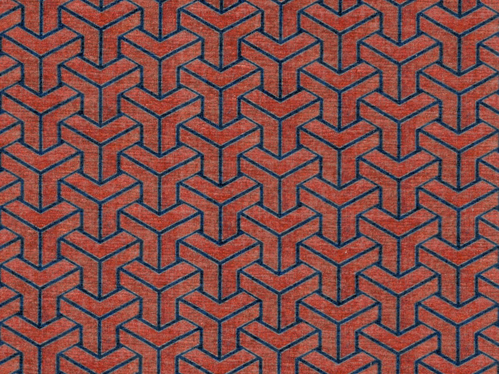 Terracotta-red chenille with navy interlocking cube geometry and softly napped texture