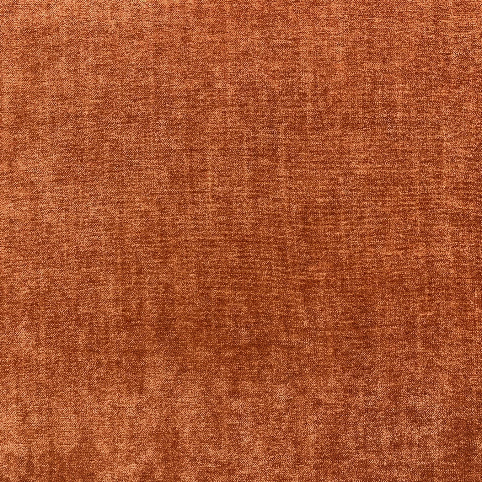 Deep rust terracotta chenille with softly mottled copper-brown woven texture