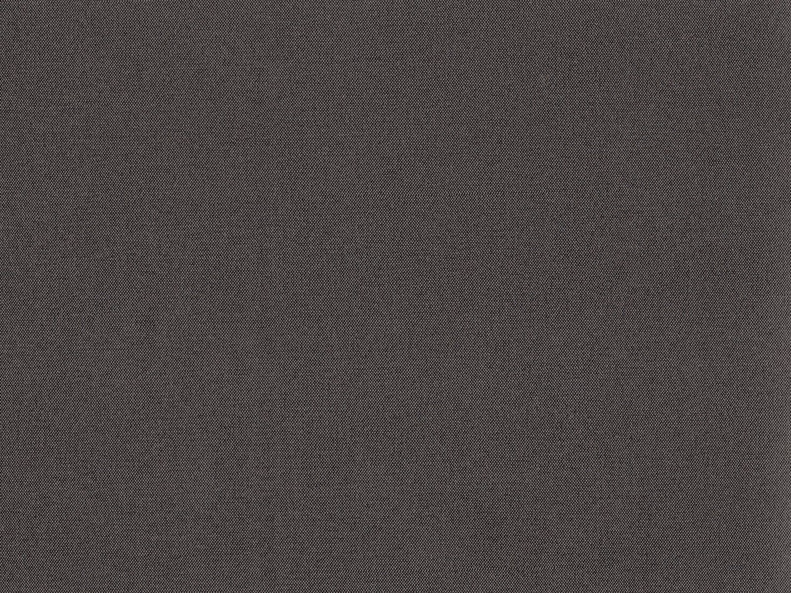 Close-up of charcoal-grey flat weave with subtle tonal texture and fine weave