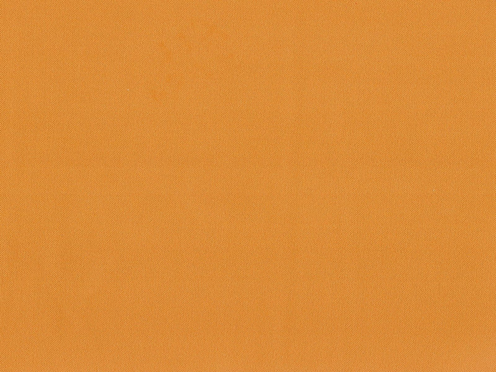 Warm ochre-orange flat weave showing a fine, even woven texture
